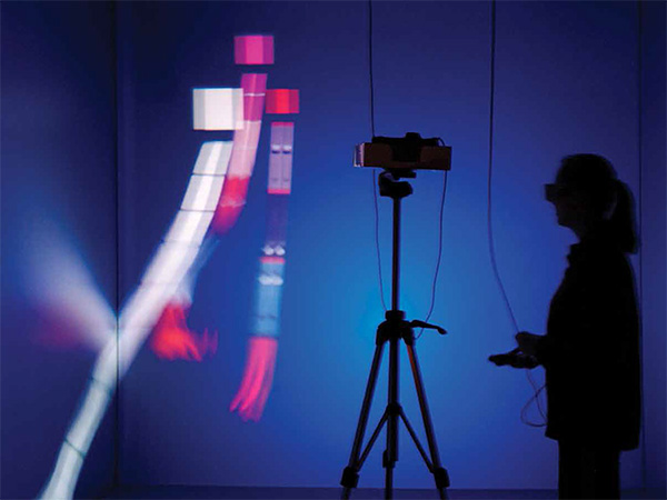 Silhouette of Jackie Matisse in Virginia Tech’s virtual reality CAVE™